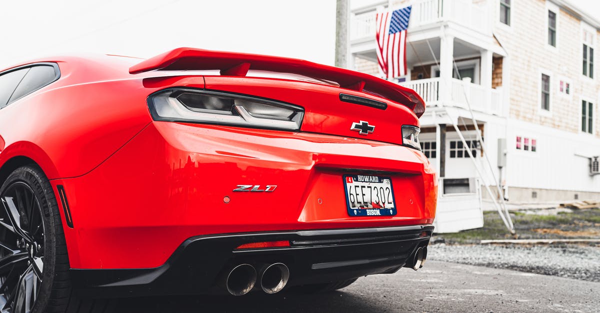 Back to back single entry visa passport stamping - Red Chevrolet Camaro Parked on Road