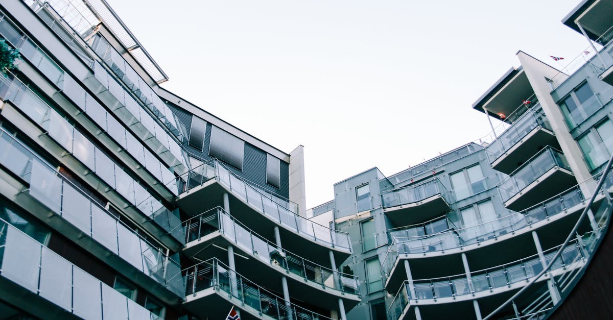 Back to mainland Norway from Svalbard - Modern geometric glass building with balconies