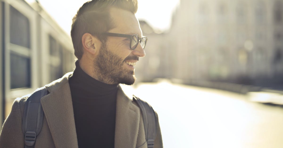 Backpack in France [closed] - Shallow Focus Photography of Man Wearing Eyeglasses