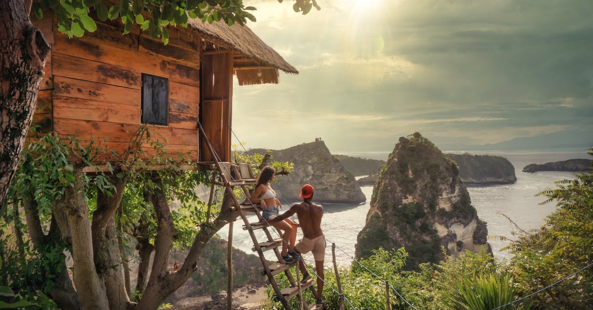 Backpacking through Indonesia during Ramadan (Bali and Gili) [duplicate] - Couple Sitting on Brown Wooden Ladder