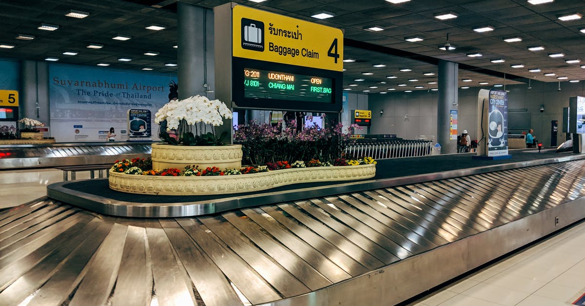 Baggage claim during changing flights - A Luggage Conveyor Inside Airport