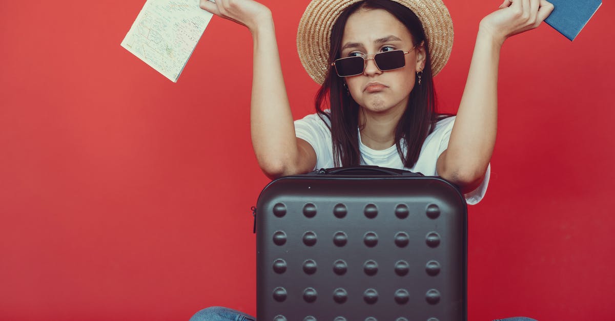 Baggage issues on Qatar Airways ticket - Anxious young lady with tickets and passport on red background