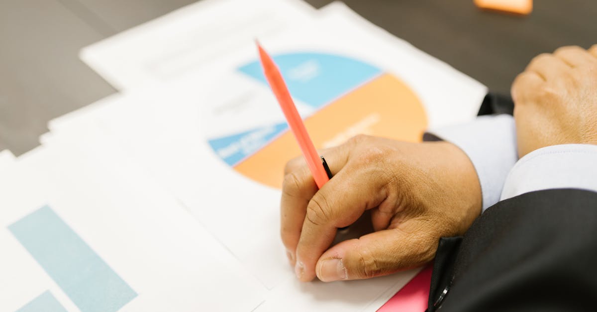 Ban for 5 years.. accused of using false documents - Close-Up Shot of a Person Writing on a Paper