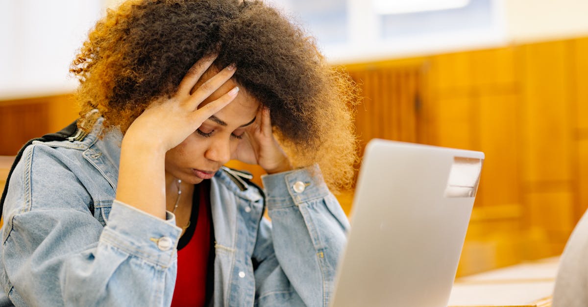 Bank statement requirements for student visa in Netherlands [closed] - Woman in Blue Denim Jacket Covering Her Face With Her Hand