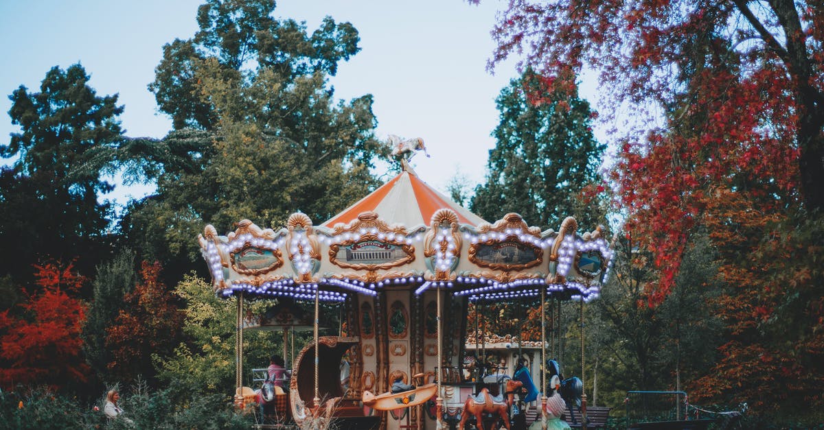 Barbecuing in a public park in Athens - Carousel surrounded with green trees