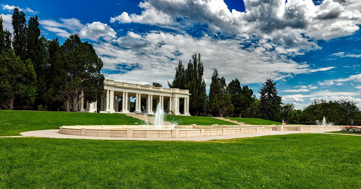 Barbecuing in a public park in Athens - White Concrete Building Under Blue Cloudy Sky