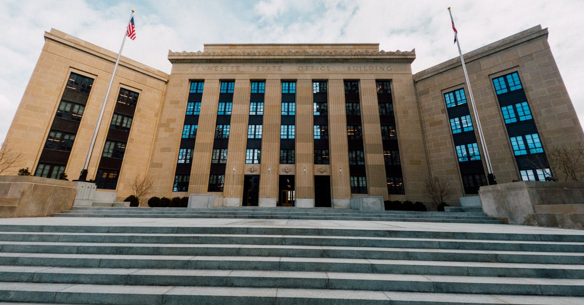 Being charged for an automatically cancelled reservation in the US - Fed building facade against stairs in city