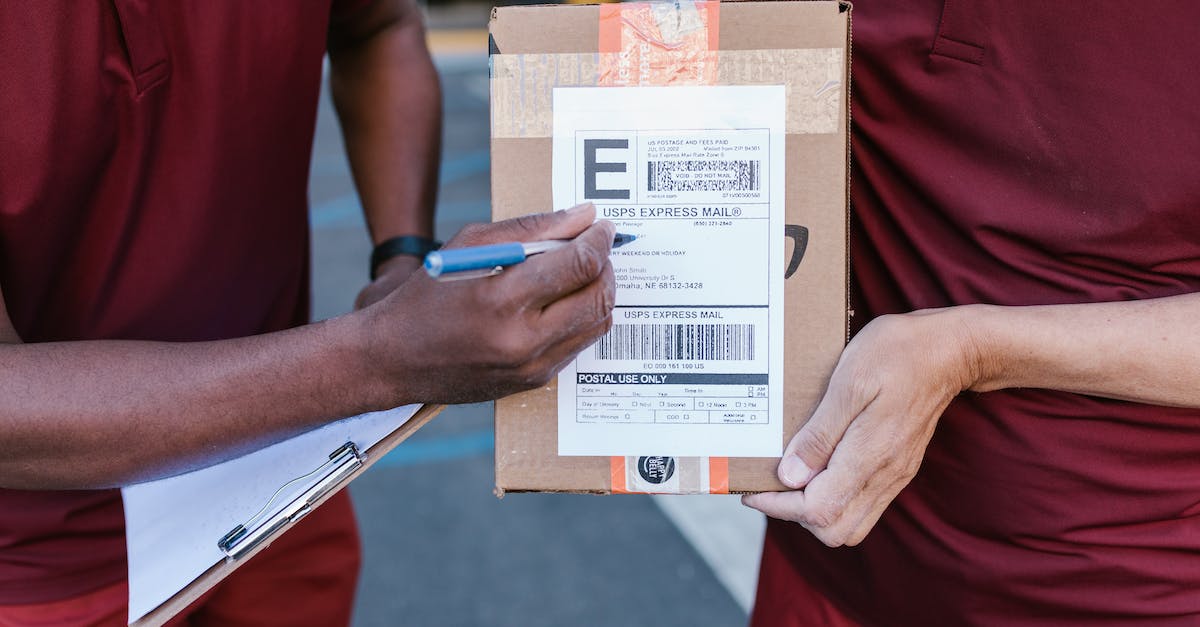 Benefits of checking in online when checking bags - Person Holding Brown Cardboard Box