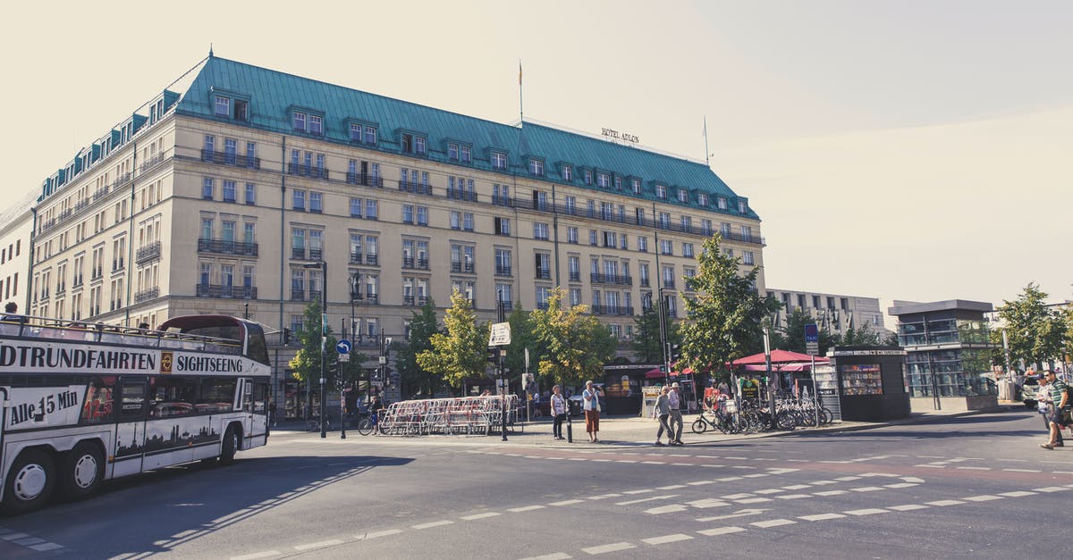 Berlin to Auschwitz by car - People Walking on Sidewalk Near Building