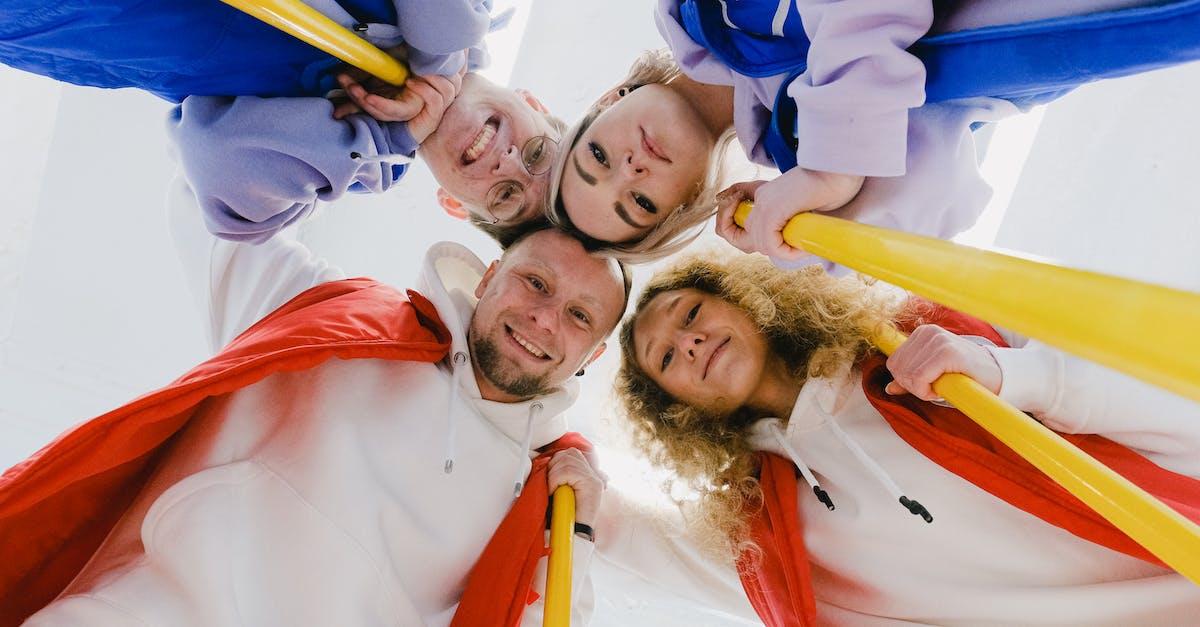 Best company for flying from Europe to Australia [closed] - Glad sportsmen in group embrace during curling game