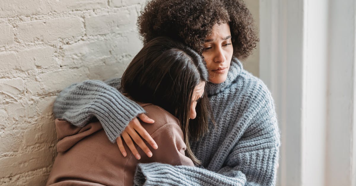 Best inside tip for Liechtenstein? - Sad multiracial women hugging at home