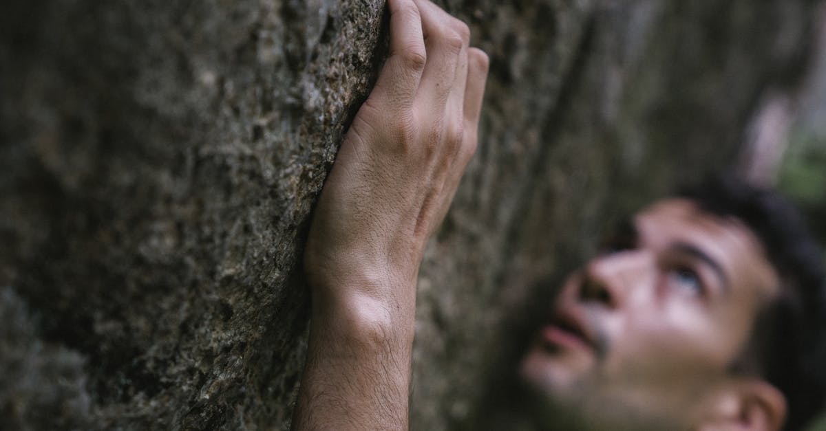 Best rock climbing places near Paris (France) [closed] - Close-Up Shot of a Man Climbing a Rock