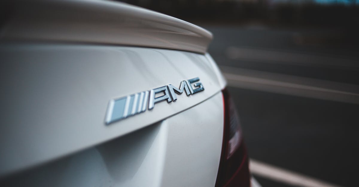 Best route to travel among: Cologne, Copenhagen, Oslo, Stockholm [closed] - Closeup of chrome logotype on trunk of new shiny white modern car driving on asphalt road