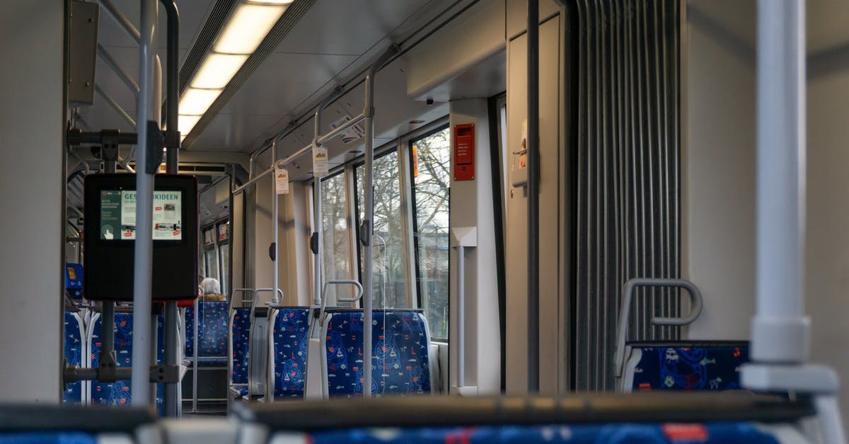 Best seats in a bus if travelling with kids [closed] - Empty Blue Vehicle Seat