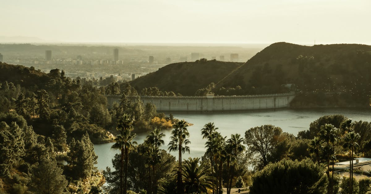 Best source to keep track of US floods? - Amazing scenery of Hollywood Reservoir and dam amidst green verdant trees and hills in California on sunny day