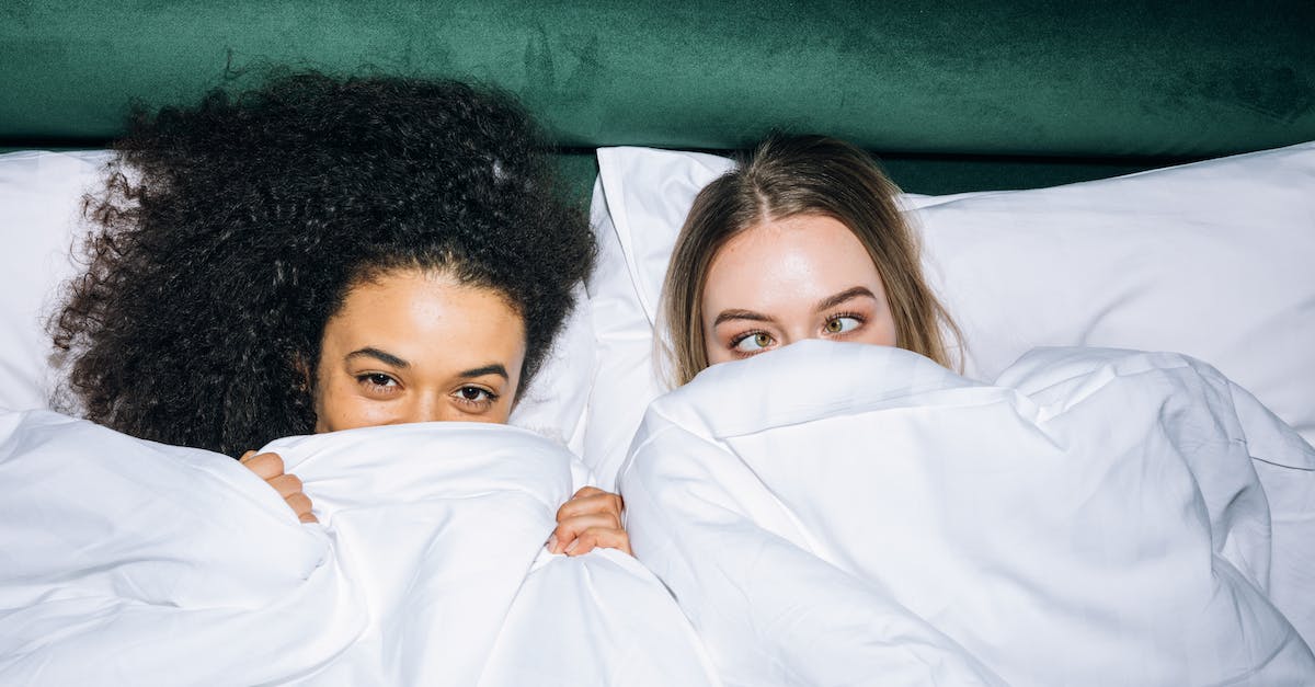 Best time for Mediterranean cruise - Two Young Girls Lying on White Bed