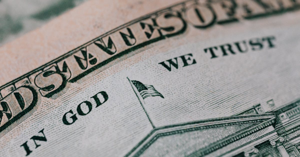Best time to buy Airline tickets to Shanghai/Hong Kong from USA (Dallas/Fort Worth)? - Closeup of ten dollar with inscription In God We Trust bill placed on table with different money