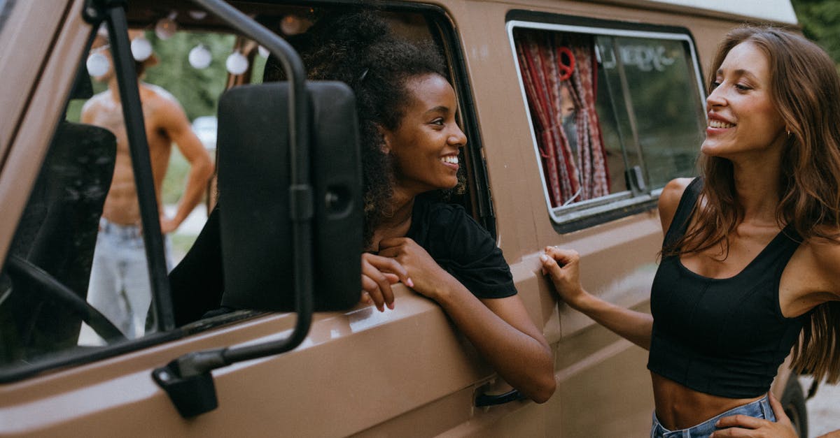 Best transportation method in Sicily - Smiling Women Looking at Each Other