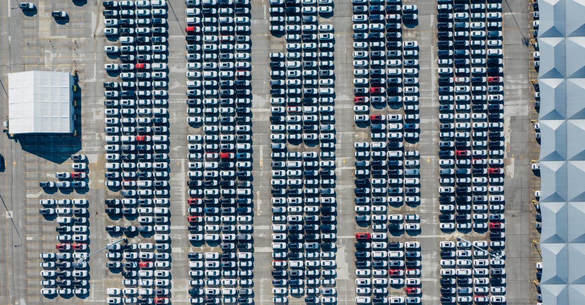 Best way to get from San Diego to Los Angeles by public transport (no Greyhound) - Aerial view of various modern vehicles parked in row on street near modern building on sunny day