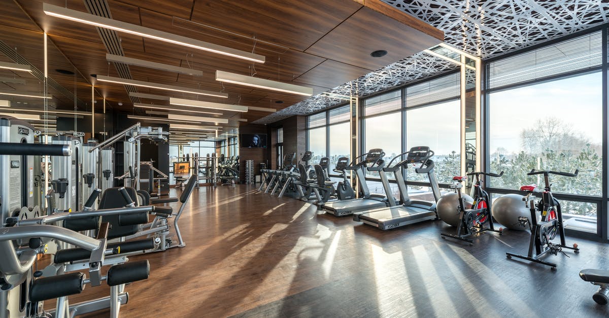 Bicycle rental in Belo Horizonte? - Interior of modern fitness club with various machines and equipment