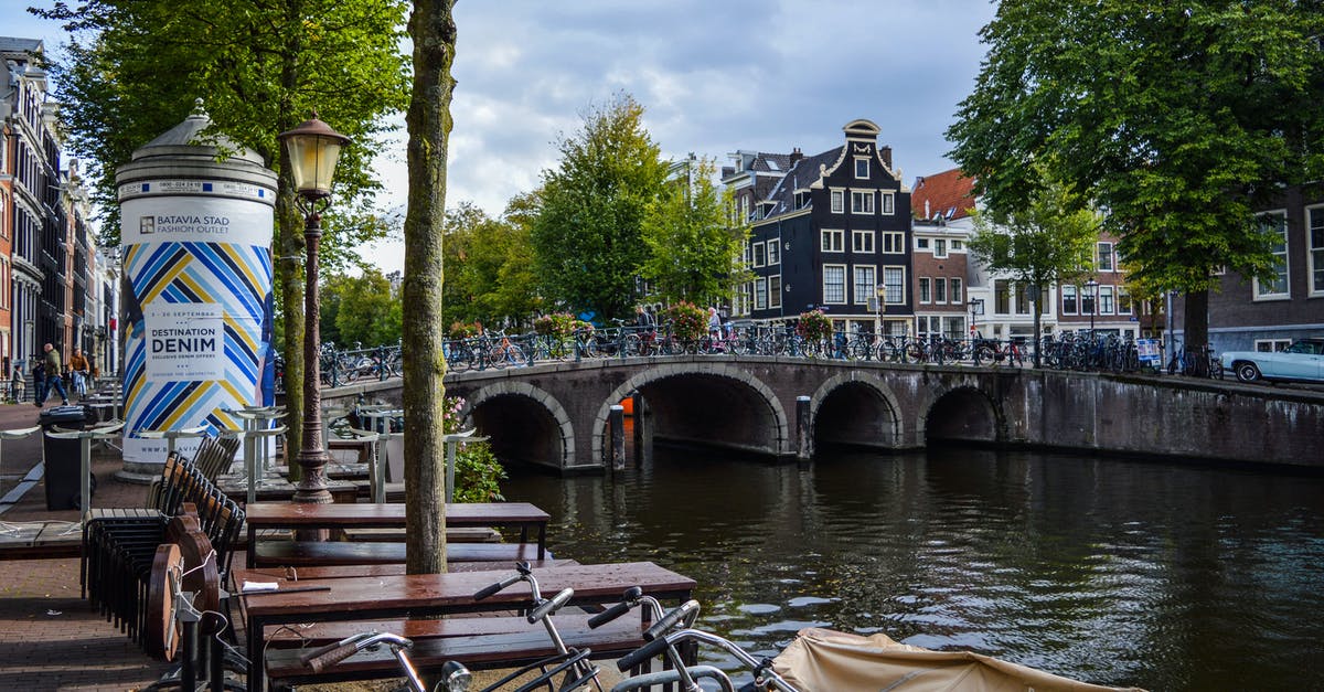 Bicycle rental in Netherlands with drop-off in another city - Arched bridge over canal in city district