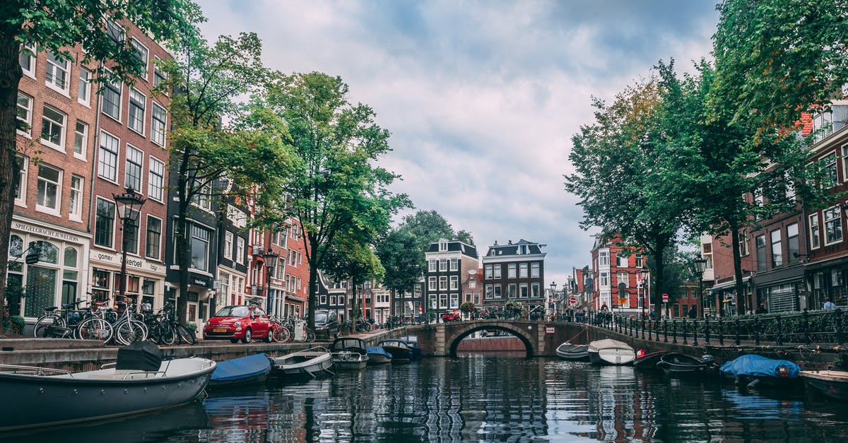 Bicycle rental in Netherlands with drop-off in another city - Photo of Boats Parked on River