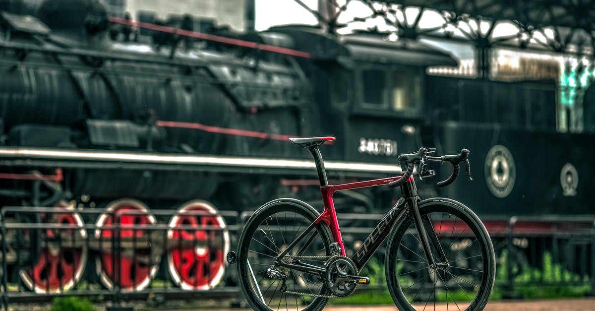Bicycles on Batumi-Tbilisi train - Black And Red Road Bike Near Black Train