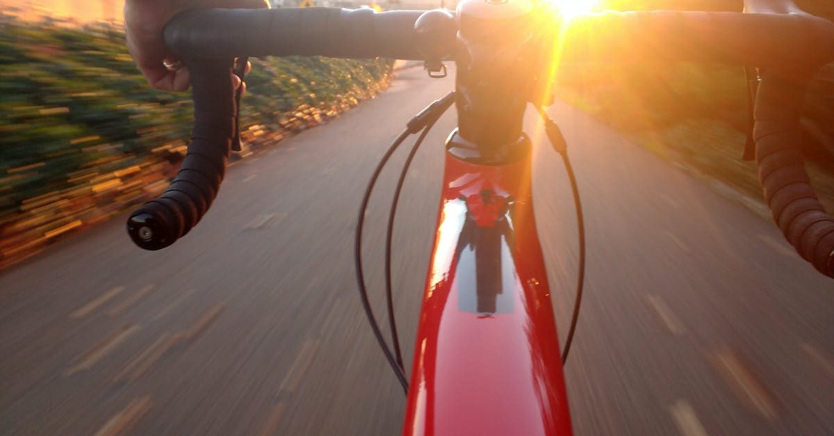 Bicycling routes in Śląskie/Małopolskie - Person Riding on Red Road Bike during Sunset