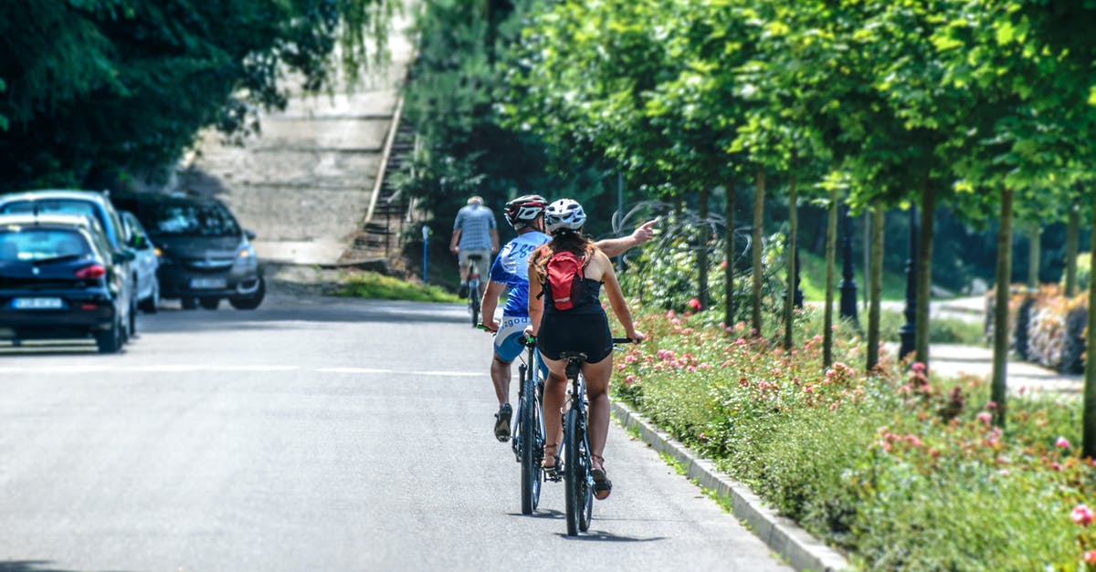 Biking tour in Russia - Man and Woman Riding Bicycle