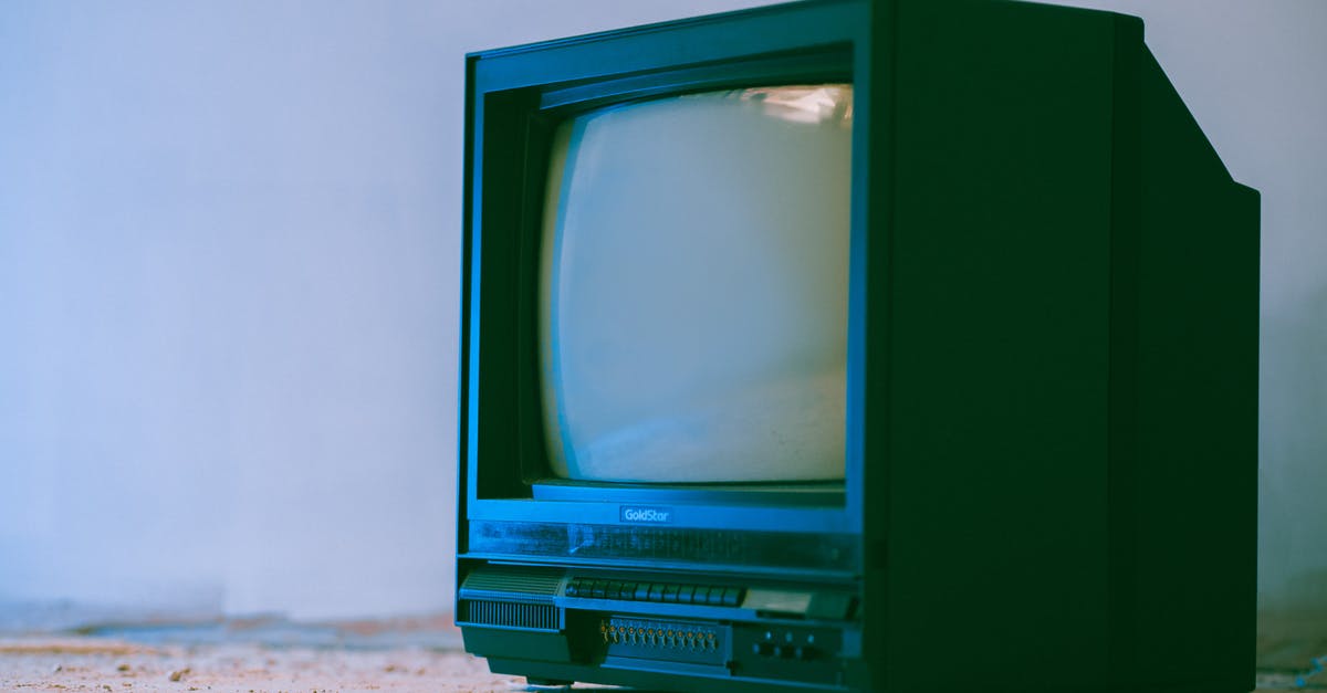 Black Labyrinth or Tube it in Waitomo? [closed] - Aged television set with control panel and plastic case near wall in building on white background