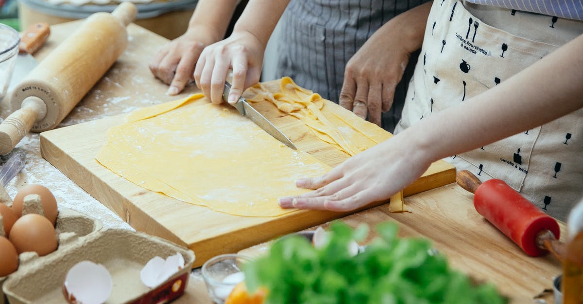 Boarding passes when going through long layovers / stopovers? - Women making homemade pasta in kitchen