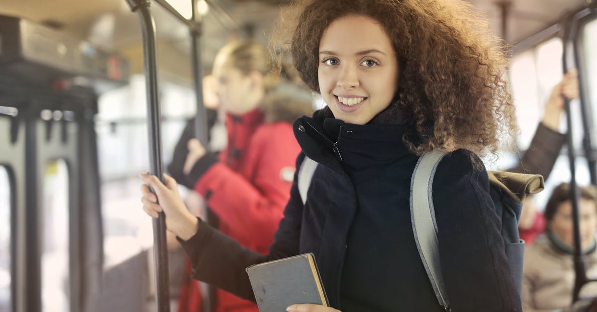 Book bus in Laos - Woman in Black Coat Riding Subway