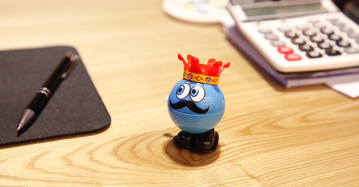 Book tickets knowing flight numbers - Blue Round Plastic Toy on a desk