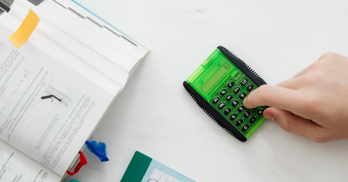 Book tickets knowing flight numbers - Person Using A Green and Black Calculator