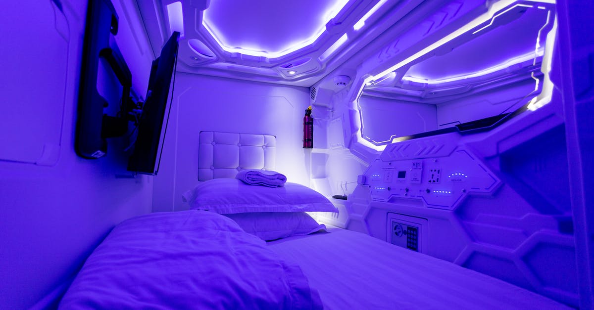 Booking a hotel for unusual hours - Interior of creative illuminated capsule hotel