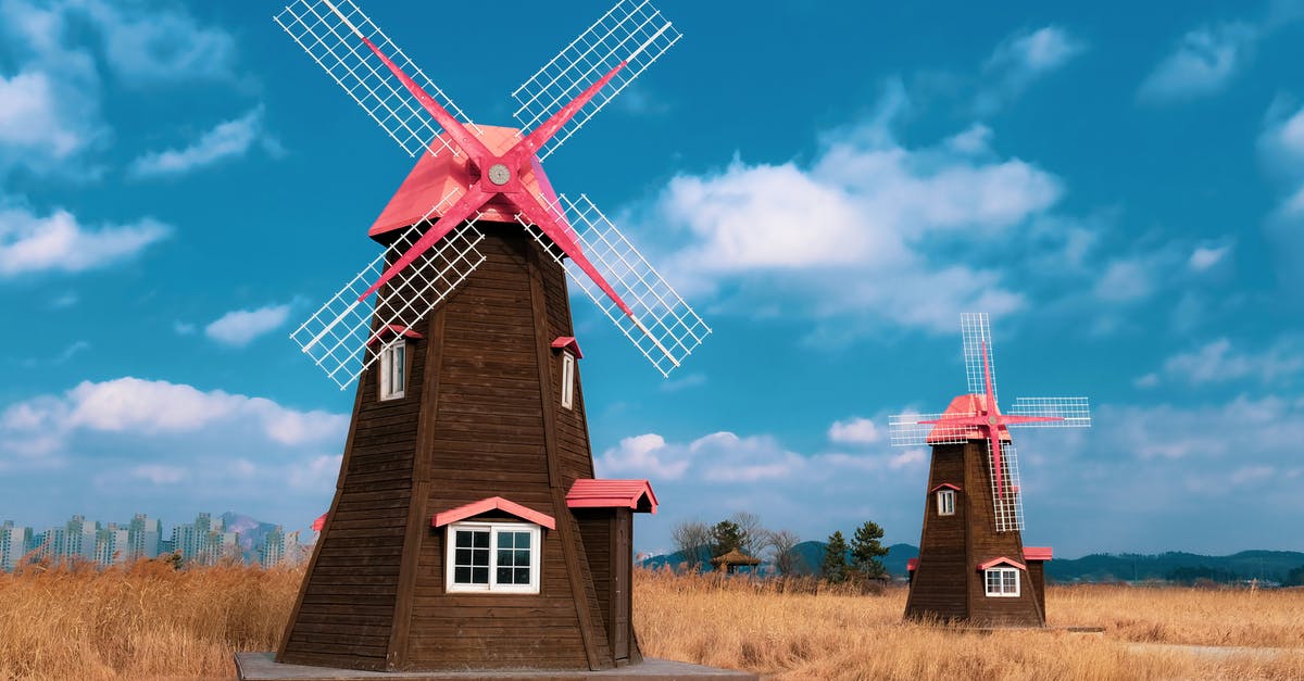 Booking hotel in South Korea - Brown and Red Wind Mill