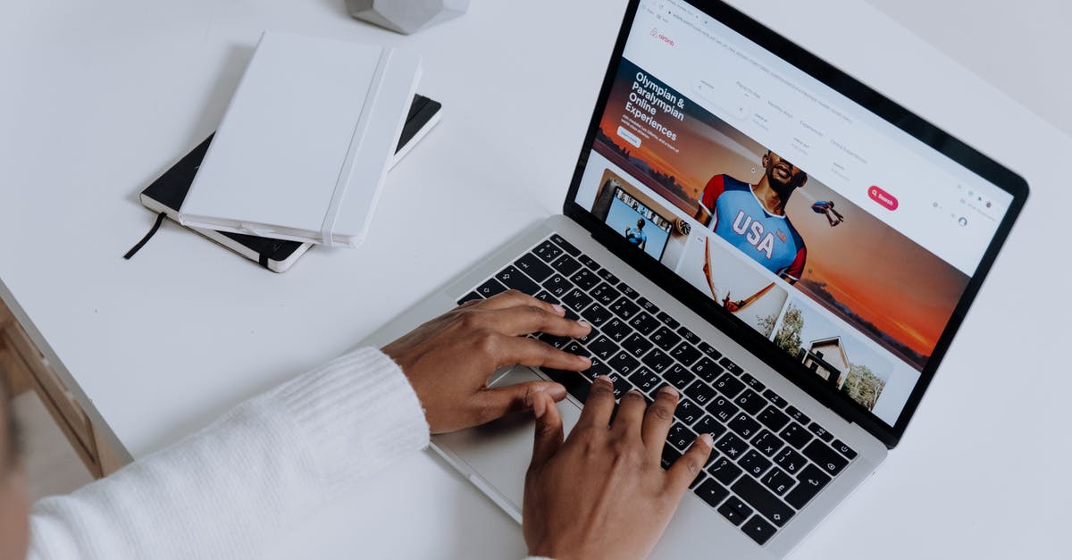 Booking.com vs AirBnb [closed] - Person Using a Macbook Pro on a White Table