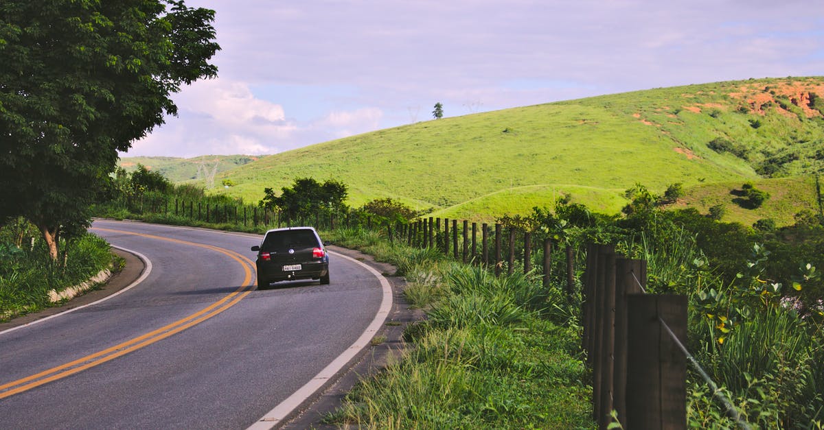 Breaking down with car during trip - multiple country breakdown service? - Black Vehicle on Road Near Green Leaf Plants