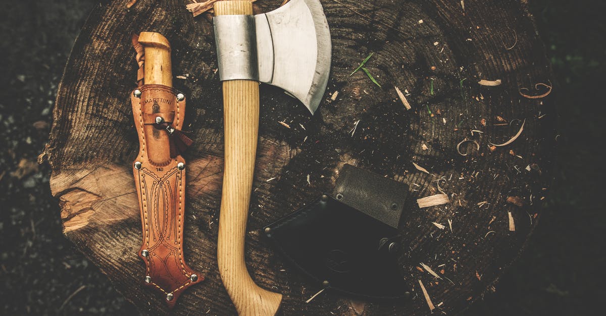 Bringing a camping knife to Japan - Brown Wooden Axe Besides Brown Leather Knife Holster
