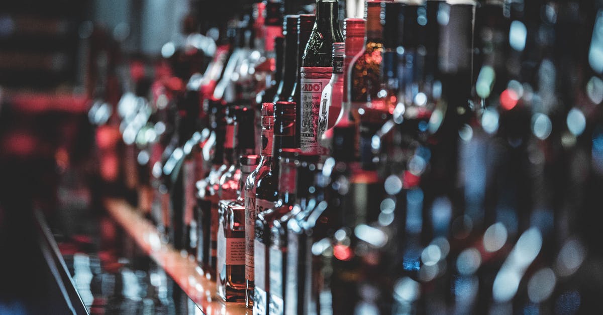 Bringing coumarin-containing liquor into the USA - Selective Focus Photo Of Alcohol Bottles