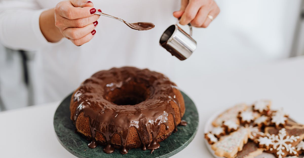 Bringing food into Australia [closed] - Person Holding Stainless Steel Fork and Knife Slicing Chocolate Cake