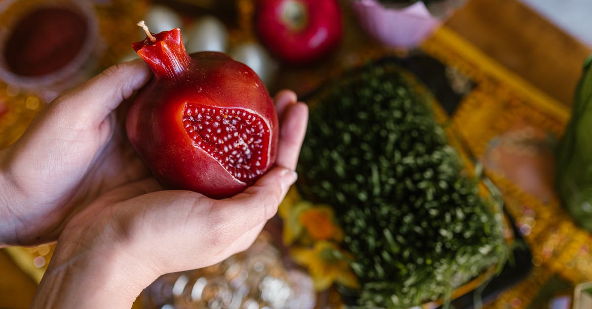 Bringing food items into the UK (from Chile) - Person Holding A Fruit Shaped Red Candle