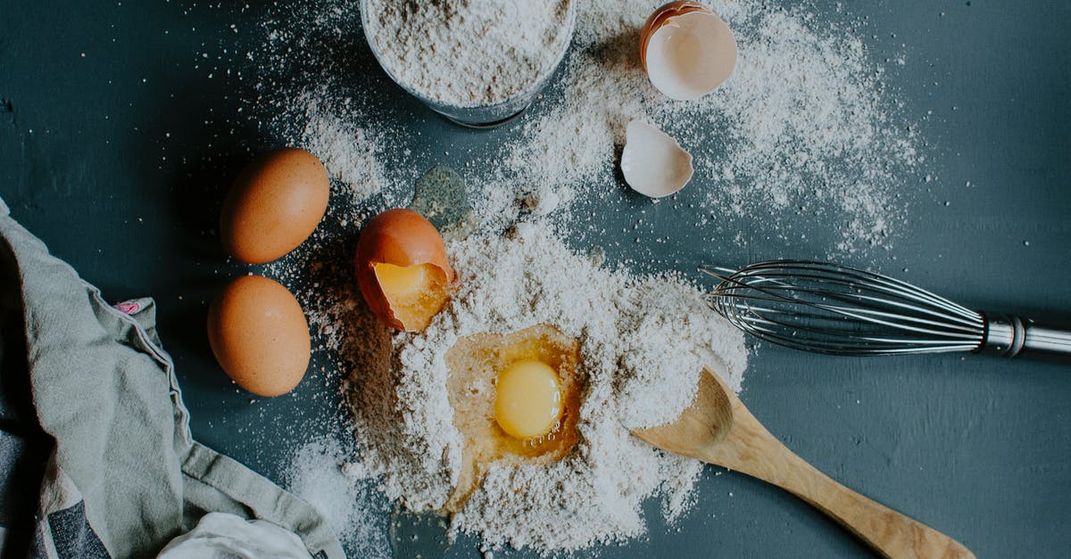 Bringing Homemade Trail Mix to Hawaii Given Food Import Restrictions - Flour and broken eggs on table before dough kneading