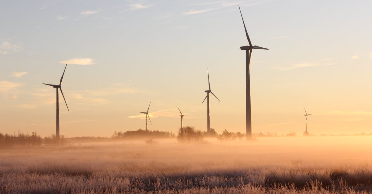 Bringing Power Supplies on Plane? - Photo Of Windmills During Dawn 