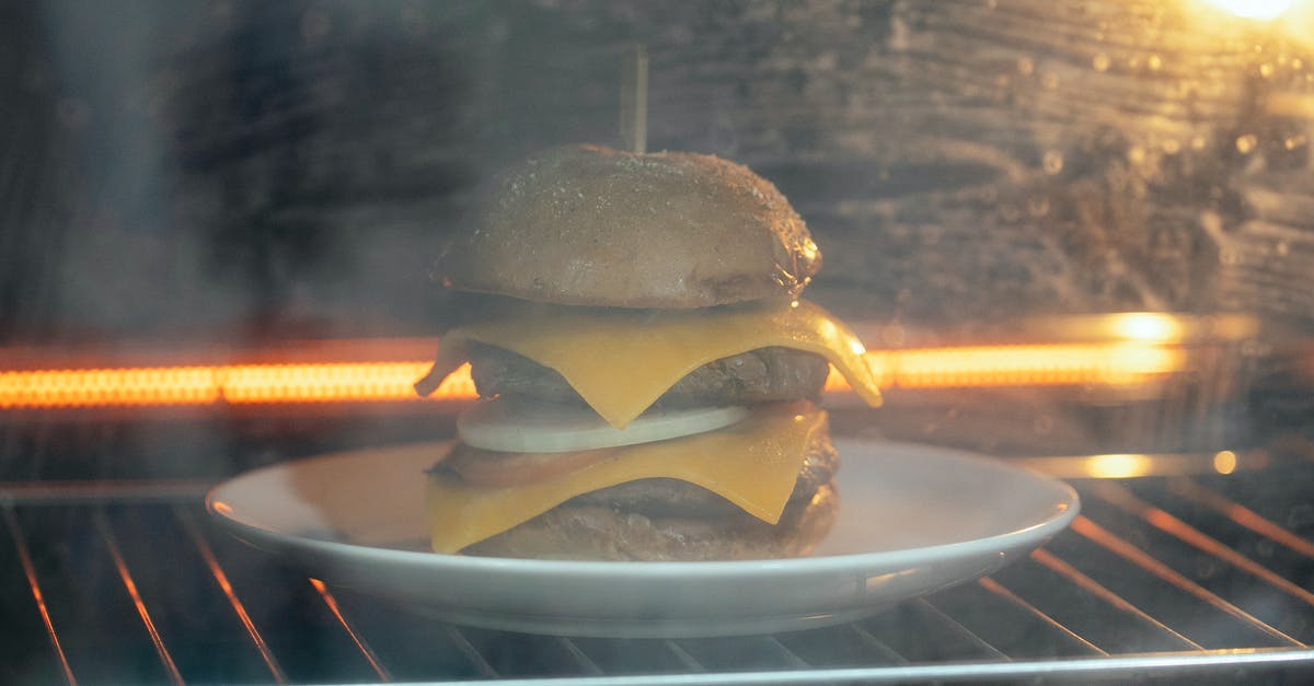 Bringing shrink-wrapped cheese through Australian Customs? - Through glass of tasty burger with cutlet and cheese served on white plate in hot oven on rack while roasting