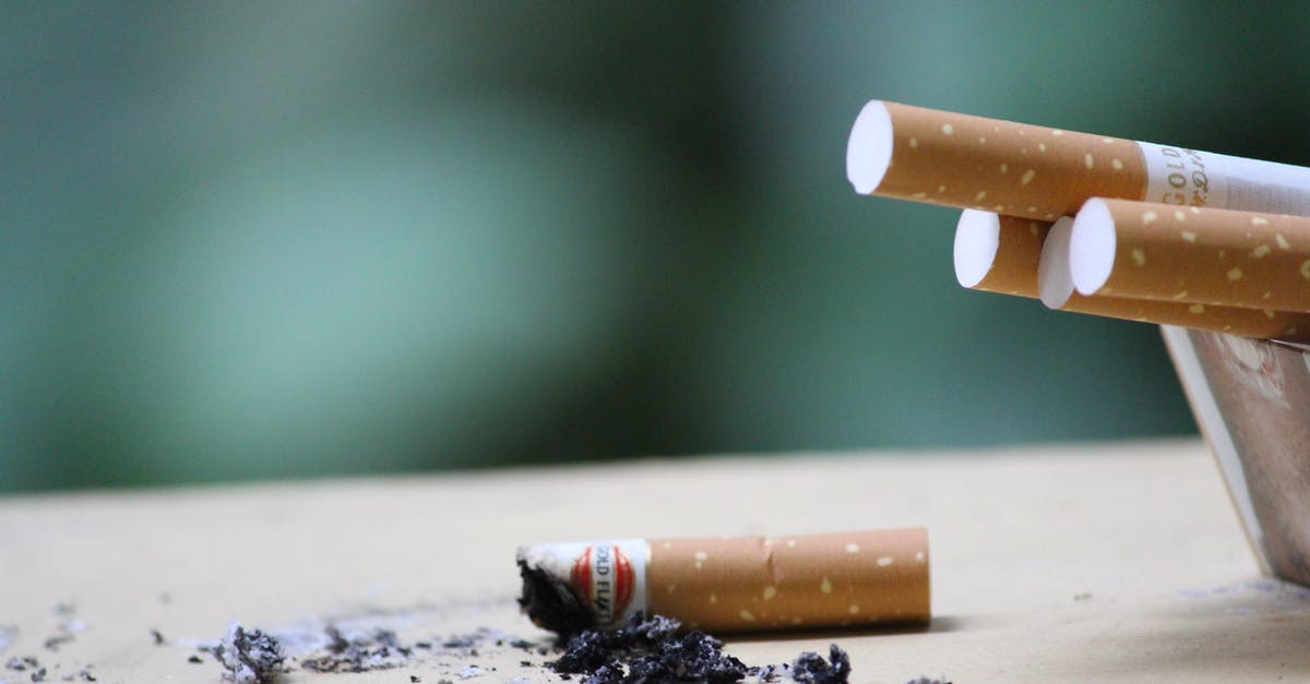 Bringing someone's ashes abroad [closed] - Close-up Photo of Cigarette Ashes