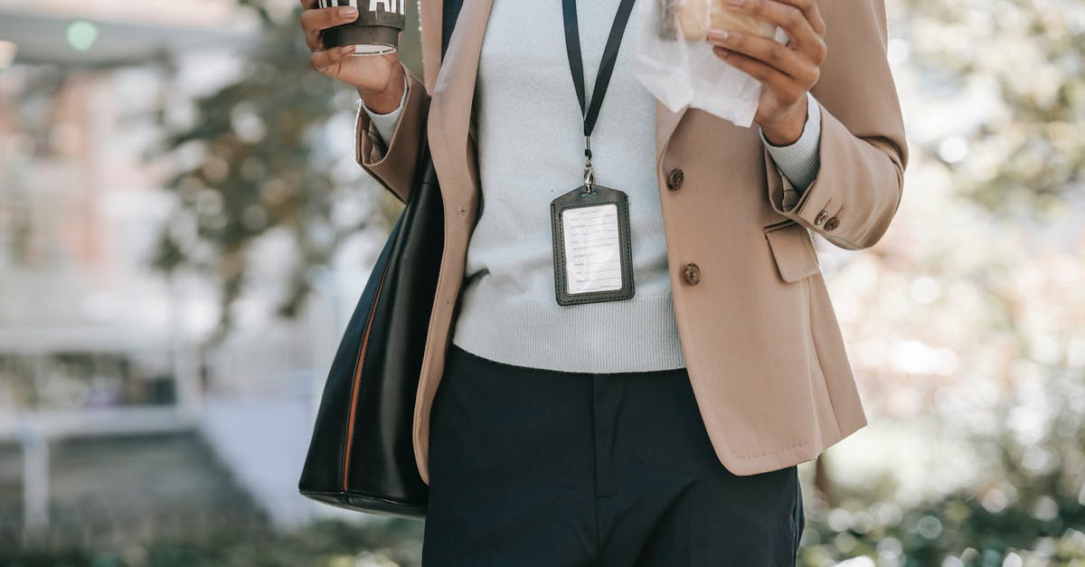 Bringing tea bags in zip lock bag to Korea? - Crop anonymous ethnic female entrepreneur with takeaway hot drink and bread walking to work