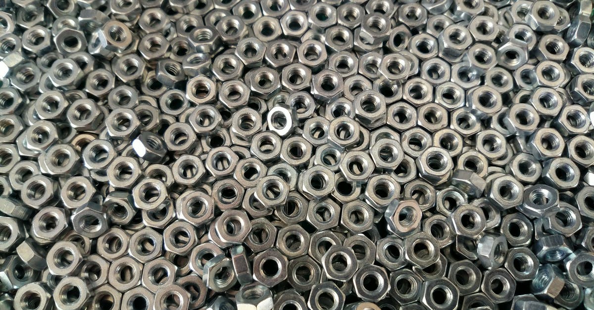 Bringing titanium alloy in luggage? - Pile of Silver Hex Nuts