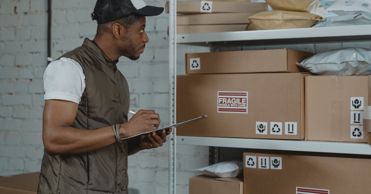 Bringing work goods across border - Man Checking Boxes for Delivery