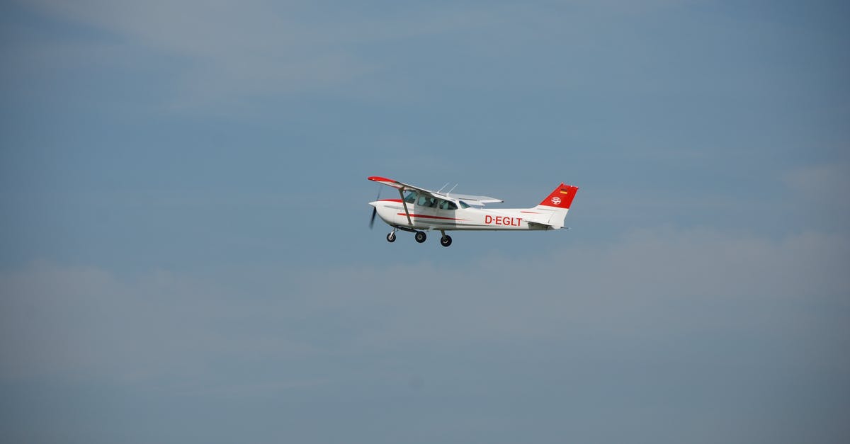 Broad flight search with specific stopover - White and Red Airplane in Mid Air